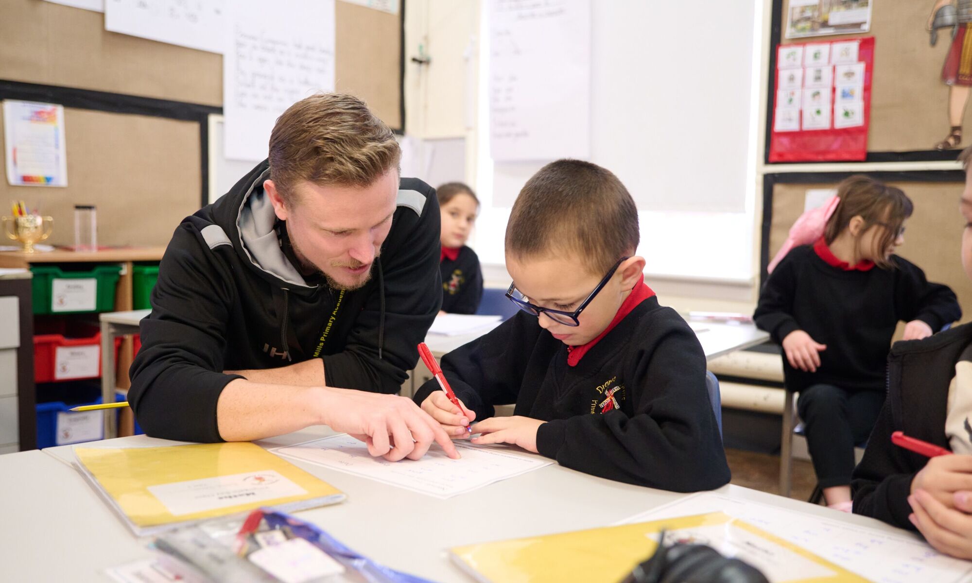 Child working with a member of staff